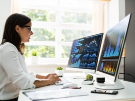 Analyst looking at data visualizations.